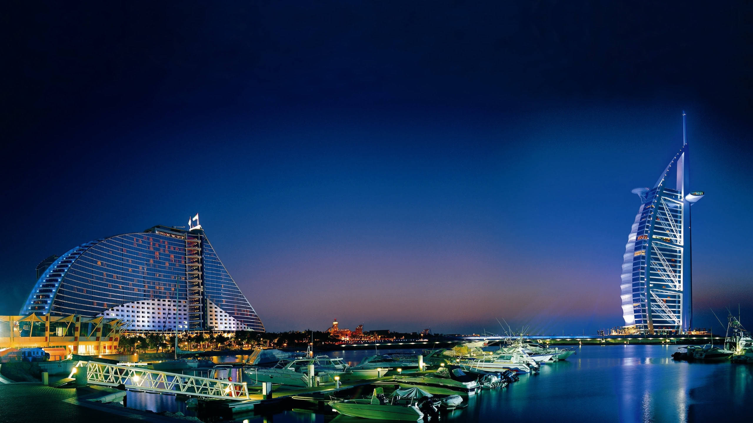 Dubai Marina skyline and Burj Al Arab coastline at sunset